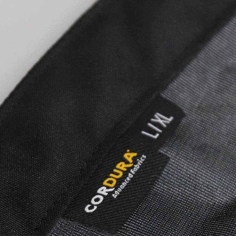 Close-up of Cordura Boot Gaiters label, highlighting durable Cordura fabric, size L/XL.