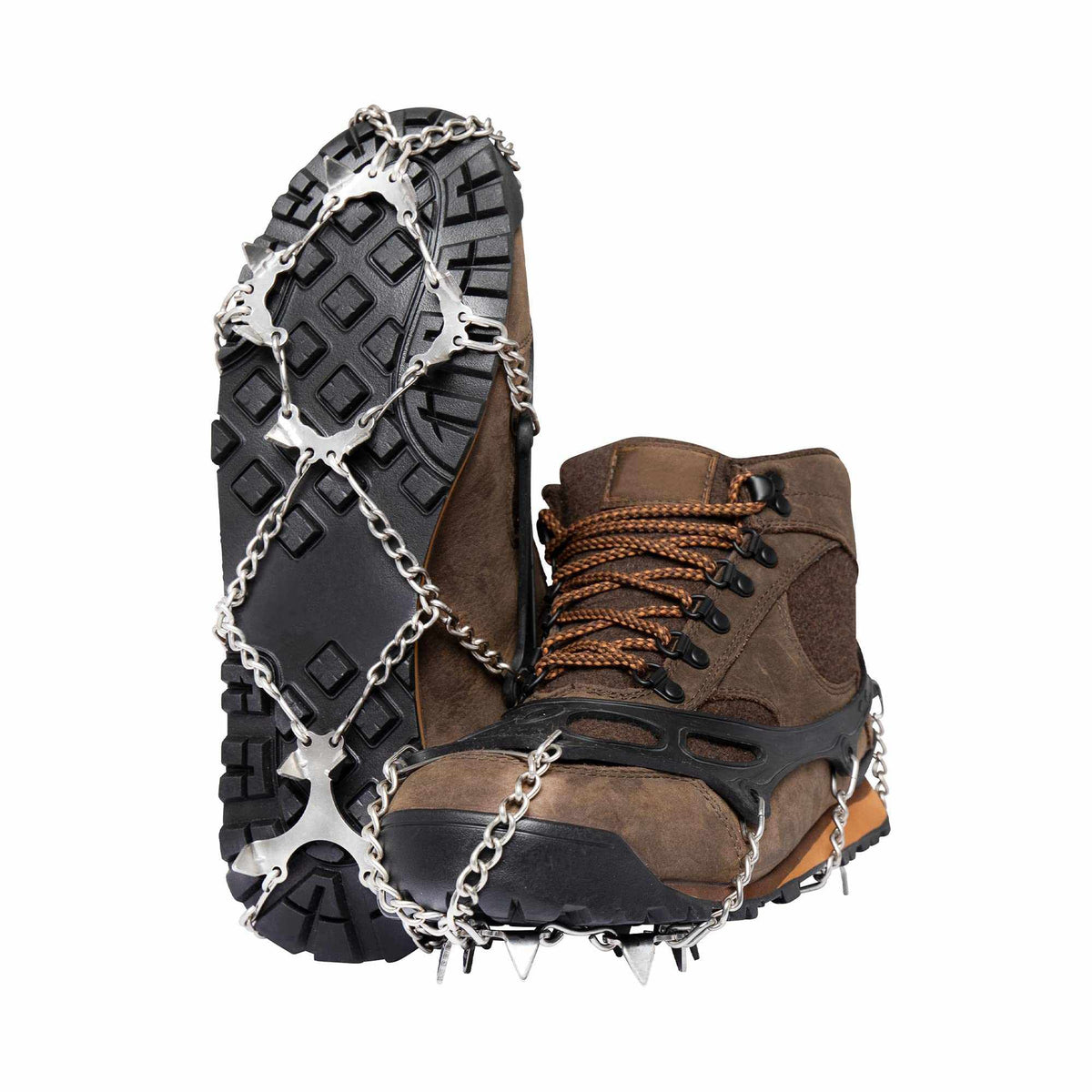 Stainless steel ice spikes on winter boots on an icy trail